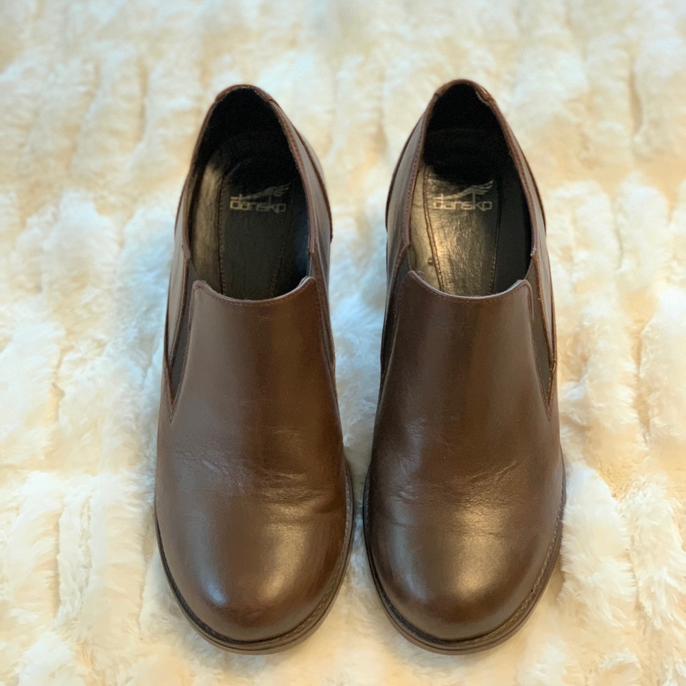 Dansko  brown leather slip on heeled clogs.